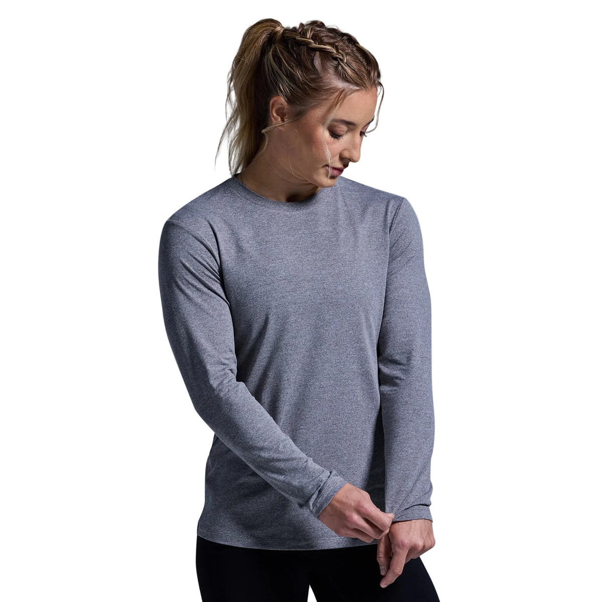 Person wearing a gray long-sleeve shirt against a plain background