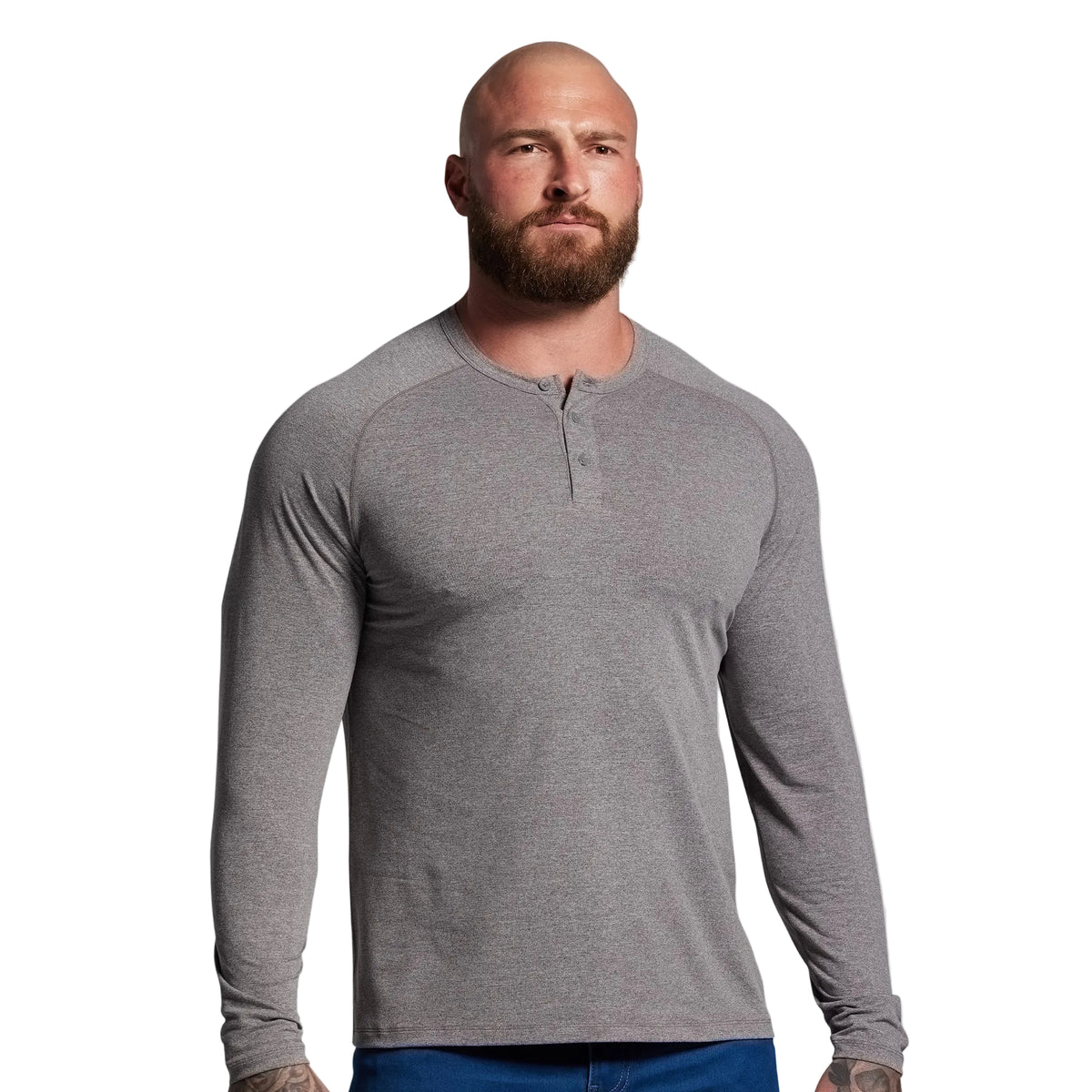 Man wearing a gray long-sleeve henley shirt against a plain background