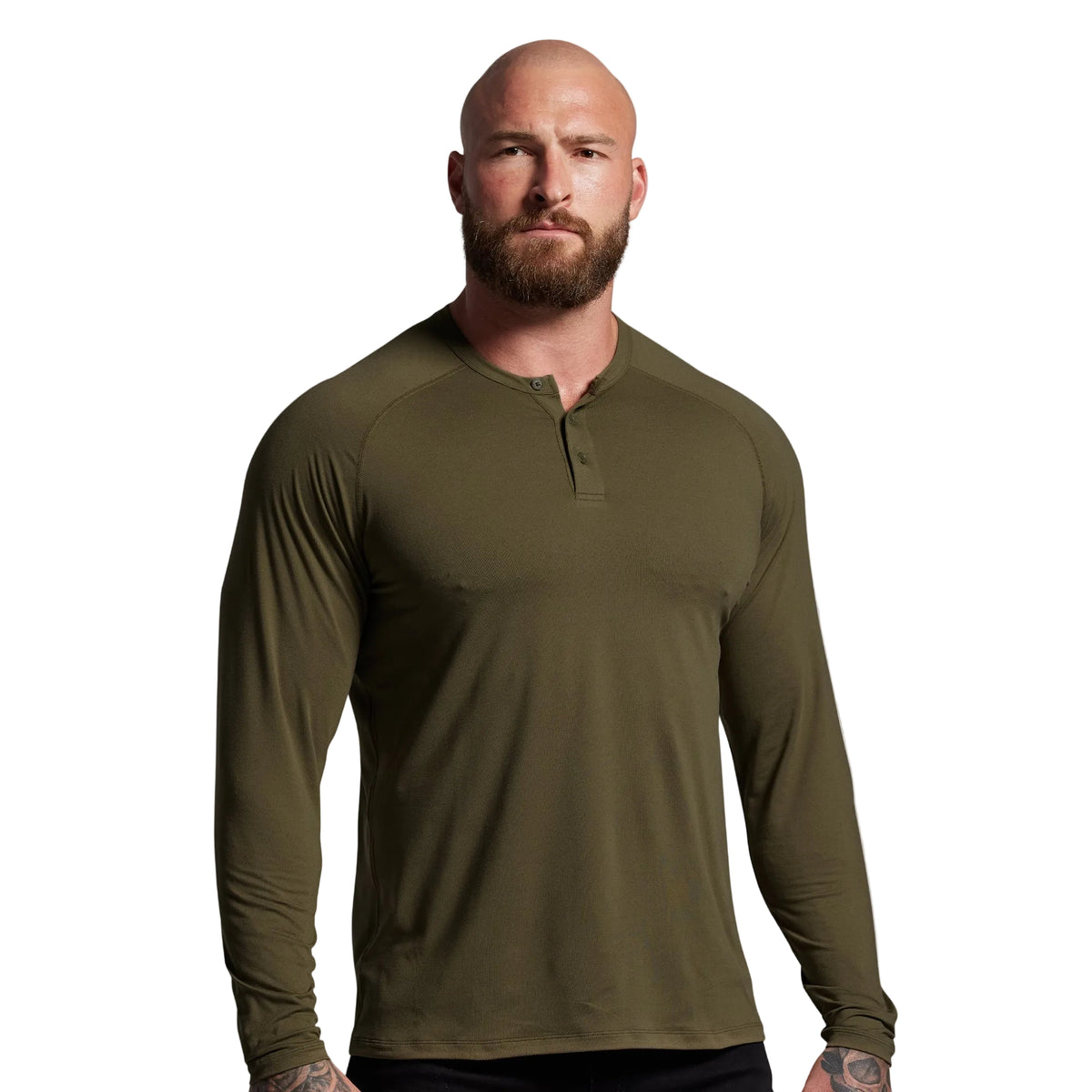 Man wearing an olive green long-sleeve shirt against a gray background