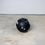 20 lb GRIND Dual-Grip Medicine Ball on floor.