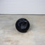 Dual-Grip Medicine Ball on floor with one handle visible.