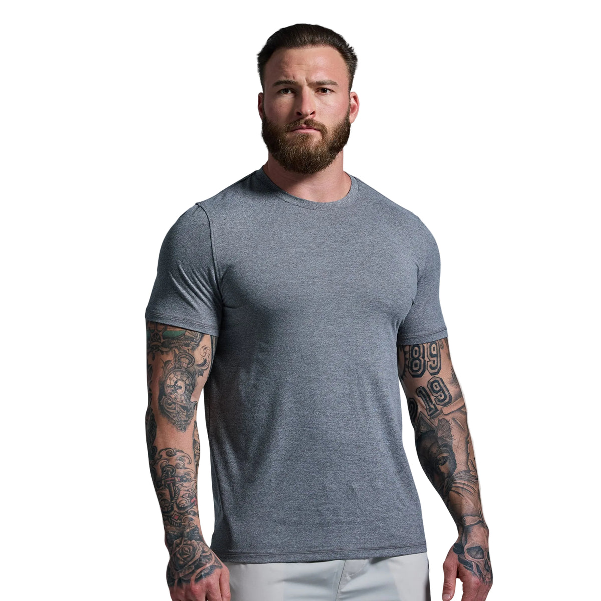 Man wearing a gray t-shirt against a plain background