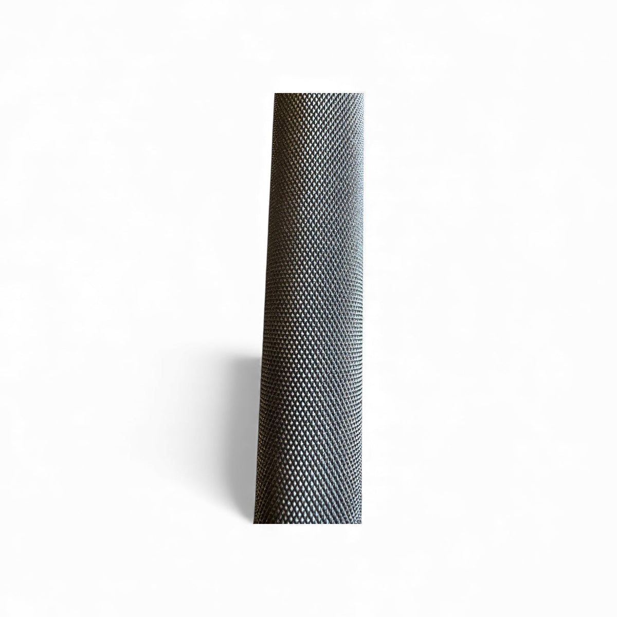 Textured black cylindrical object on a white background