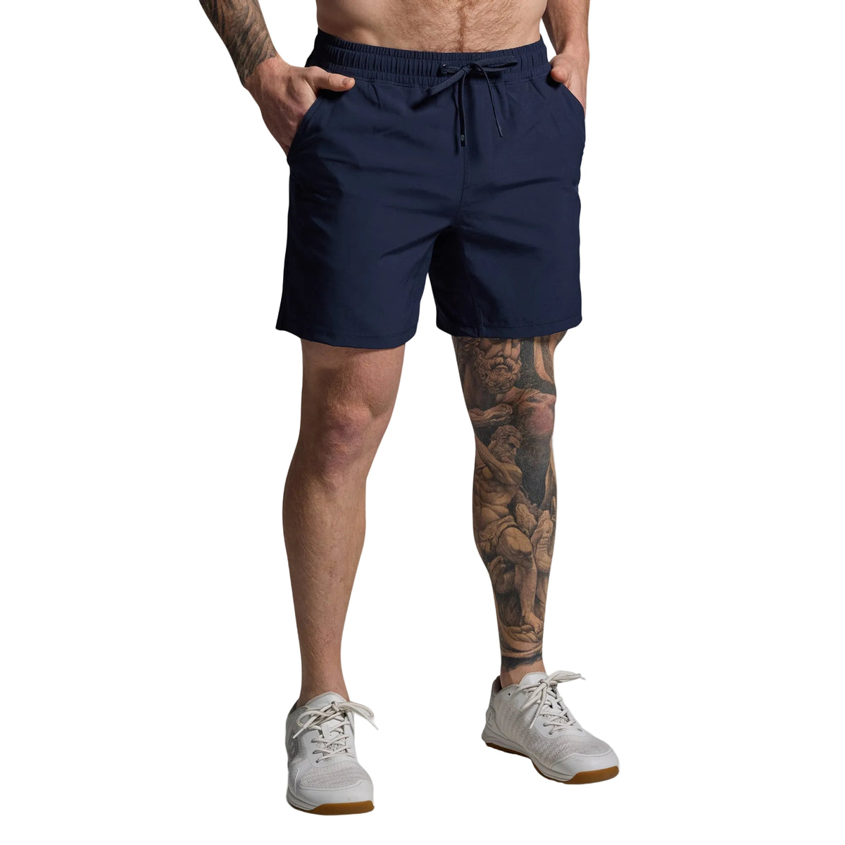 Person wearing navy shorts on a gray background