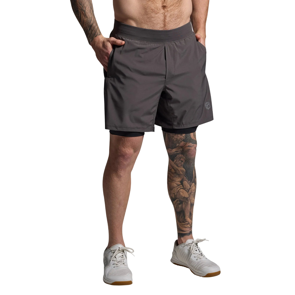 Person wearing gray athletic shorts on a light gray background