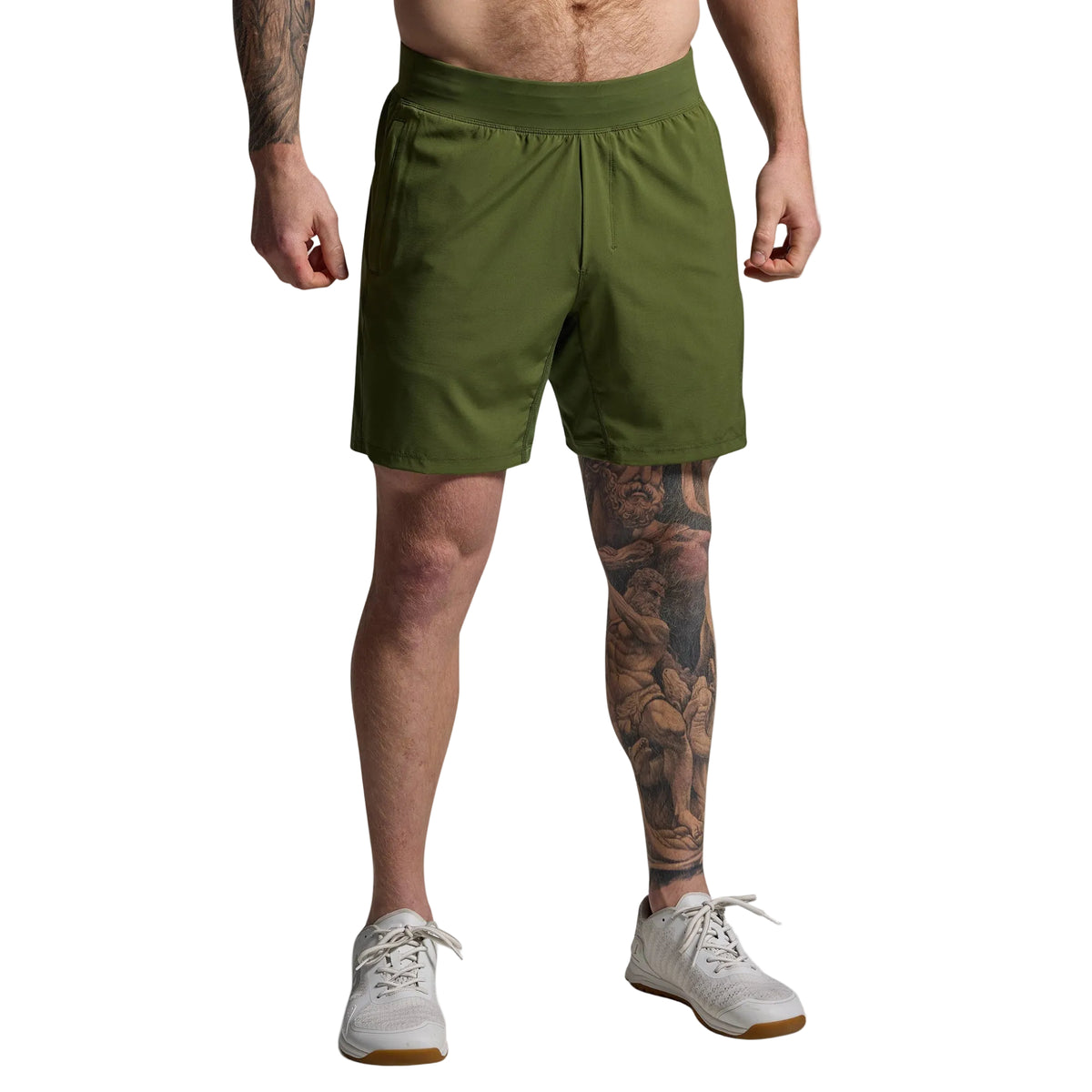 Person wearing green shorts on a plain background