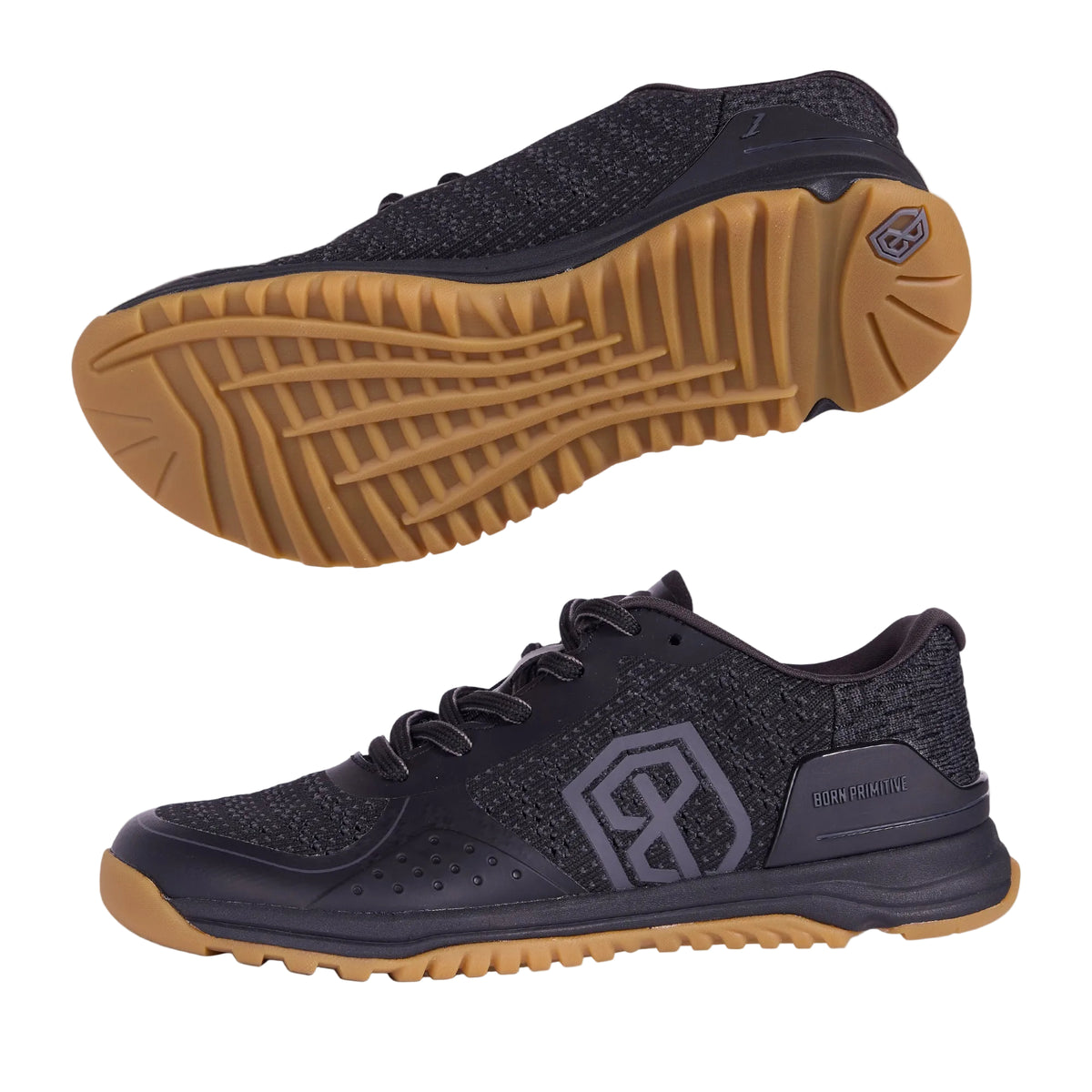 Black athletic shoe with brown sole on a gray background