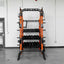 Orange and black weight rack in a gym setting with a door and wall in the background.