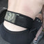 Person wearing a black weightlifting belt with camouflage pattern on a dark background