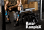 Person sitting on a weight bench in a gym with 'Bear Komplex' branding.