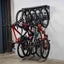 multi-bike storage mounted on the wall holding 5 bikes