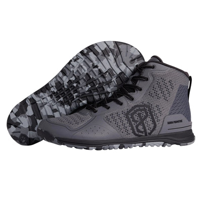 Gray athletic shoe with camouflage sole on a light gray background