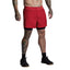 Person wearing red shorts on a plain background