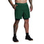 Person wearing green shorts on a gray background