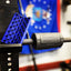 Barbell rescue tool with blue plate holder against a blurred background
