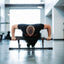 Man doing incline push up using Door Mounted Pull-Up Bar not mounted to the door, but sitting on the floor.