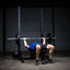 Build Limitless® Economy Squat Stand with man bench pressing