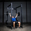 Build Limitless® Economy Full Cage with man and bench with loaded barbell