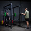 Build Limitless® Economy 6 Post with man and woman and loaded barbell