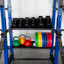 2 storage shelves held with dumbbells, kettlebells, and weight plates