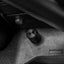 Close-up of a car's gear shift lever and surrounding area.