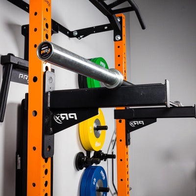 barbell resting on spotter arms between sets