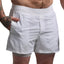 White athletic shorts worn by a person on a plain background