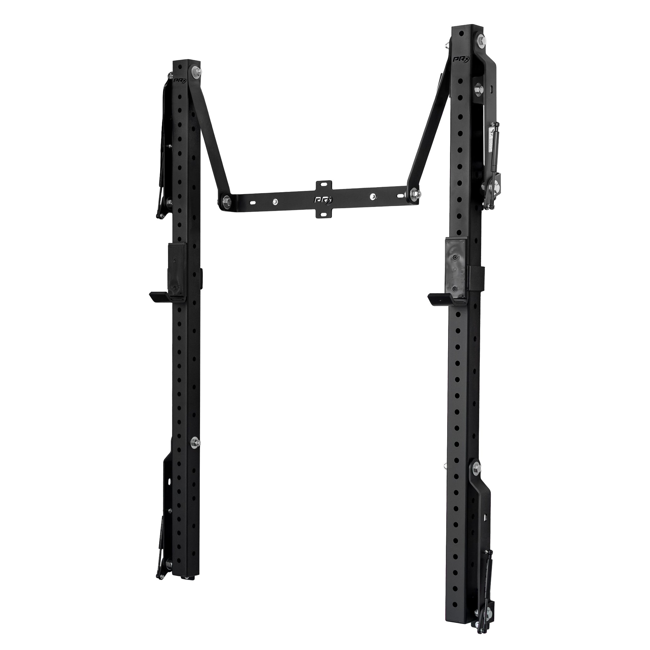 PRx Profile CORE wall-mounted folding squat rack unfolded from the wall in a low-ceiling home gym