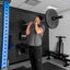 Man lifting a barbell in a gym setting with PRx equipment.