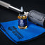 Barbell rescue bottle and towel on a black background