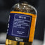 Bottle with a blue label detailing 'How to Use' on a blurred background