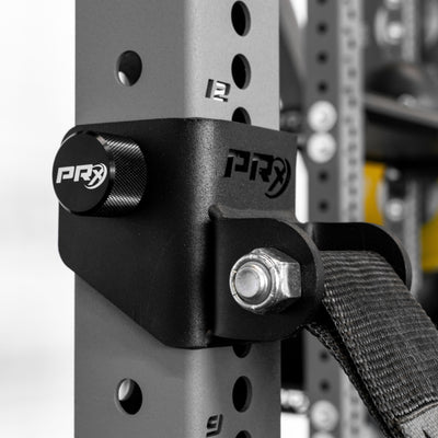 PRX weightlifting attachment on a power rack with a blurred background