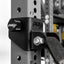 PRX weightlifting attachment on a power rack with a blurred background