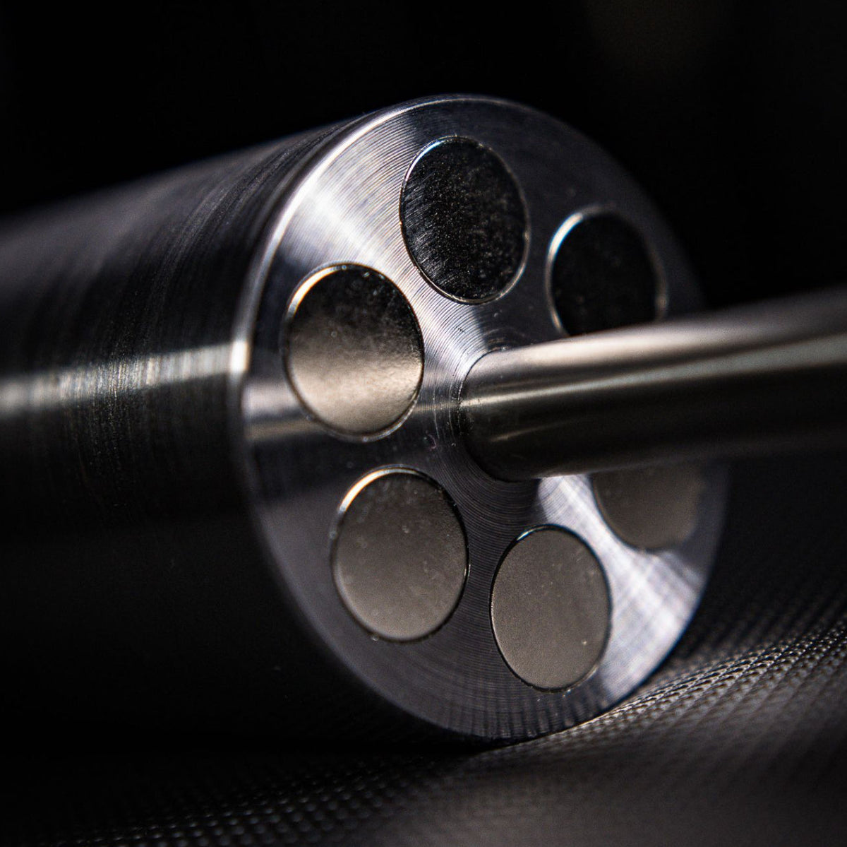 Close-up of a revolver barrel on a dark background