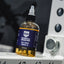 Barbell Rescue lubricant bottle on a weightlifting platform