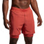 Person wearing red shorts on a plain background