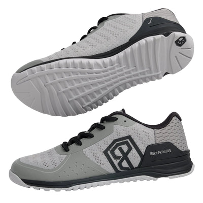 Gray athletic shoes with black accents on a light gray background