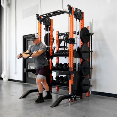 Person using a weight rack in a gym setting