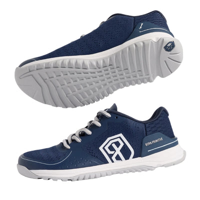 Navy running shoes with white soles on a gray background