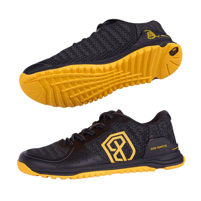 Black and yellow athletic shoes on a gray background