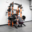 Person using a weightlifting machine in a gym setting