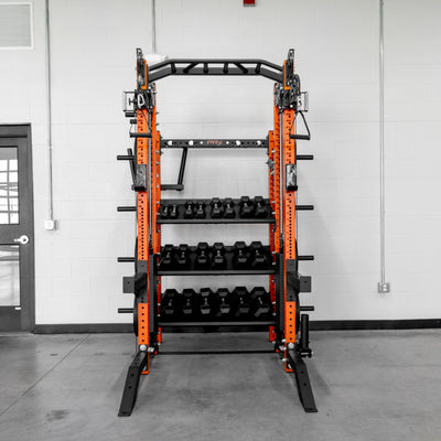 Orange and black weight rack in a gym setting with a door and wall in the background.