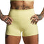 Person wearing light yellow athletic shorts with a plain background