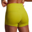 Person wearing bright green athletic shorts on a plain background
