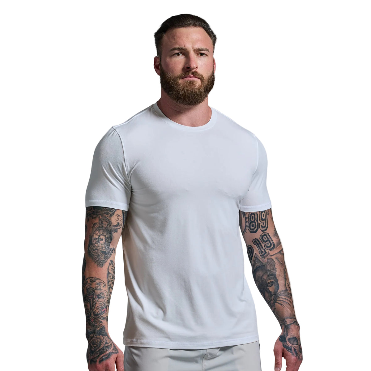 Man wearing a plain white t-shirt against a light gray background