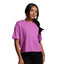 Woman wearing a purple t-shirt against a gray background