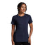 Woman wearing a navy blue t-shirt against a gray background