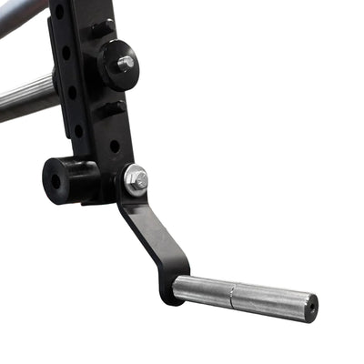 Close-up of a gym barbell with weight plates in a gym setting.