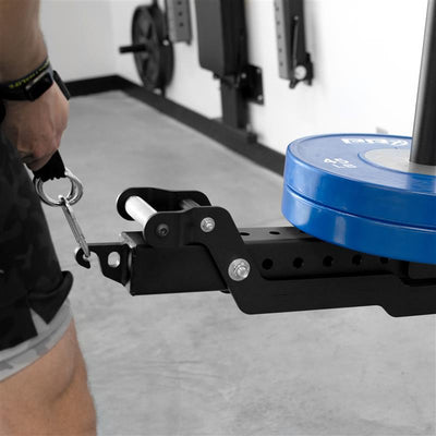 Close-up of a weightlifting machine with blue weight plates in a gym setting
