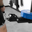 Close-up of a weightlifting machine with blue weight plates in a gym setting